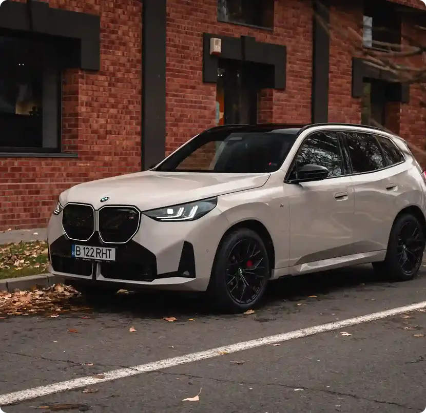A BMW X5 parked on the street, showcasing its sleek design and modern features.